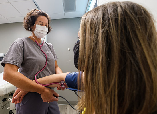 Image of nurse taking blood pressure of a patient