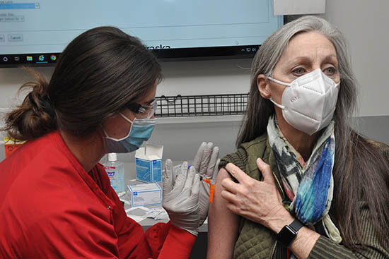 Woman receiving a vaccine