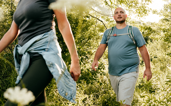 picture of a man hiking with this partner