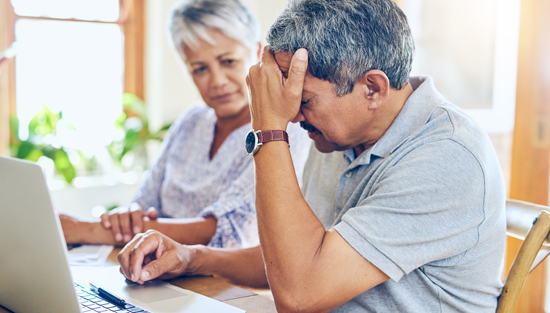 Frustrated couple looking online