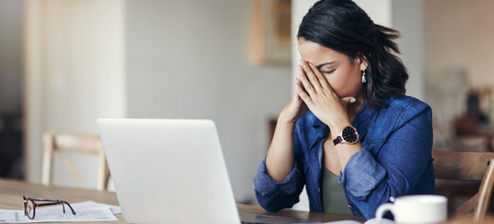 picture of a distracted woman trying to work