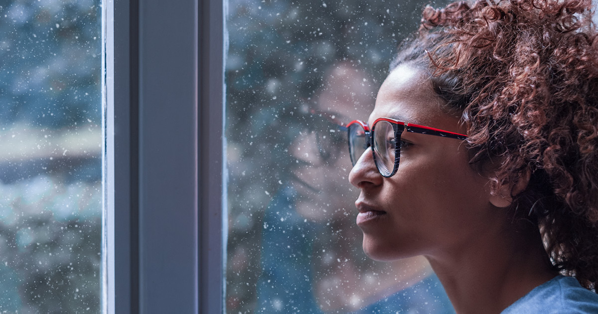 Woman staring out a window