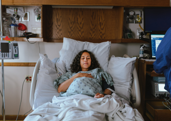 Picture of a pregnant woman in a hospital bed