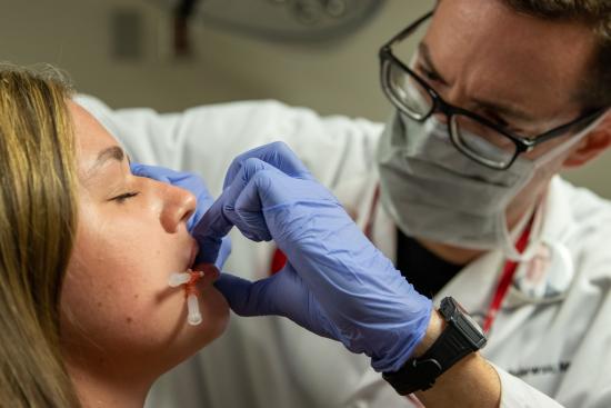 A picture of a woman receiving NovaThreads treatment