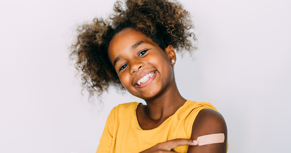 picture of a young girl with a bandaid on her arm