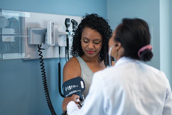 A woman having her blood pressure checked. 