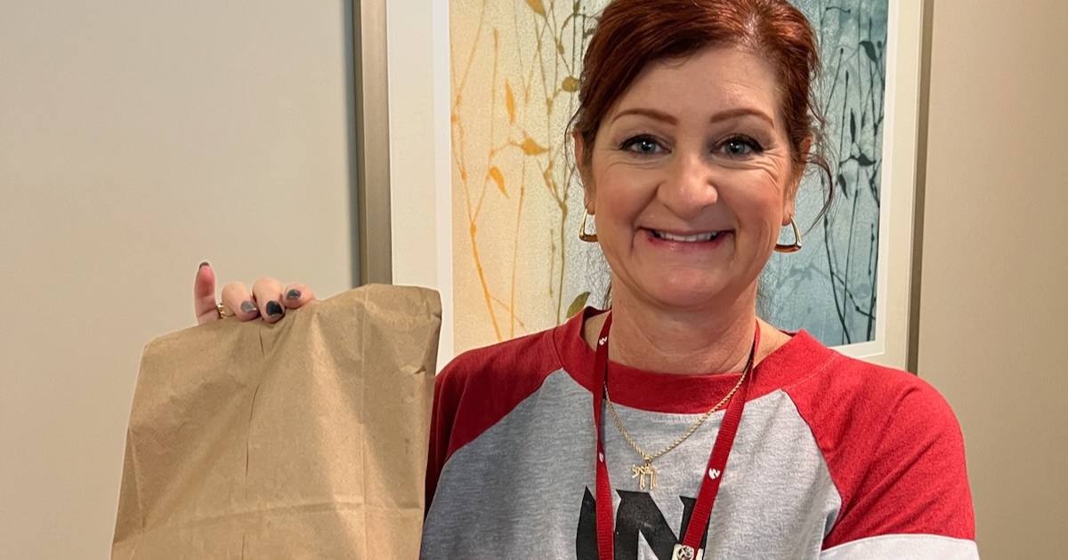 Shira Suggs holding bagged breakfast