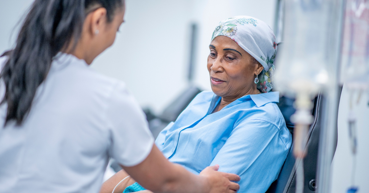 Older woman receiving chemotherapy treatment