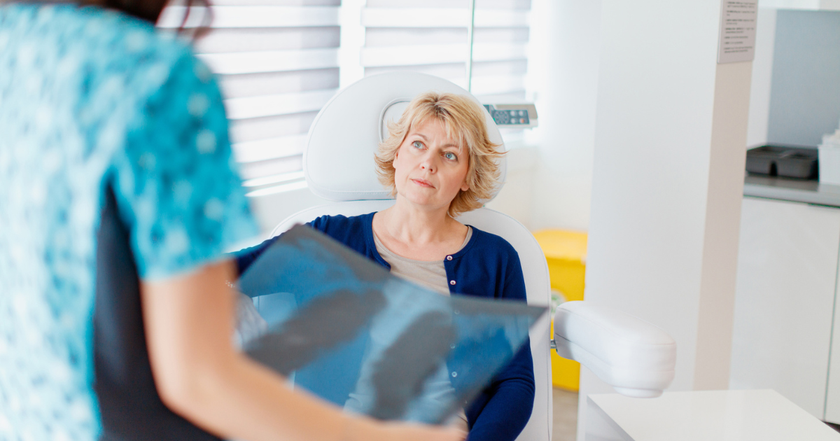 Woman reviewing lung scans with her doctor