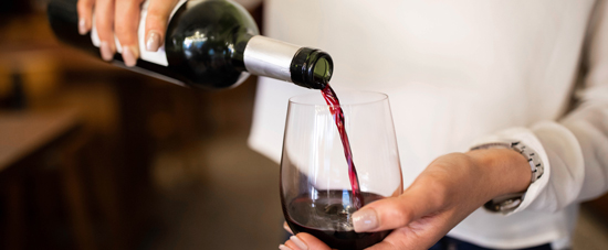 picture lady pouring wine into a glass