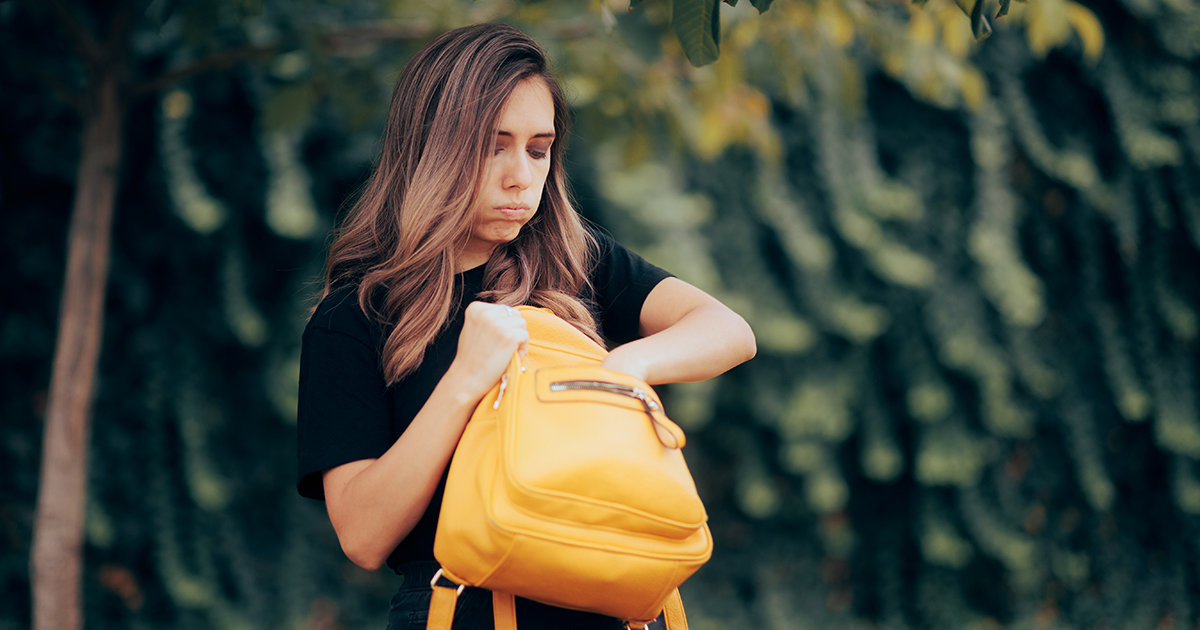 picture of a woman looking in her purse