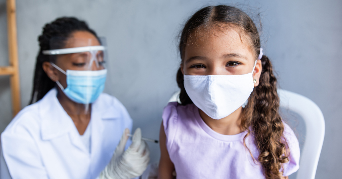 Two women masked - one child, one adult