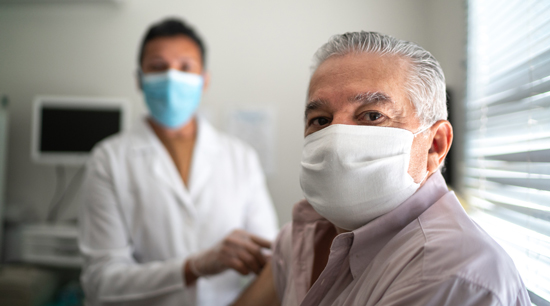 picture of a man getting his vaccine