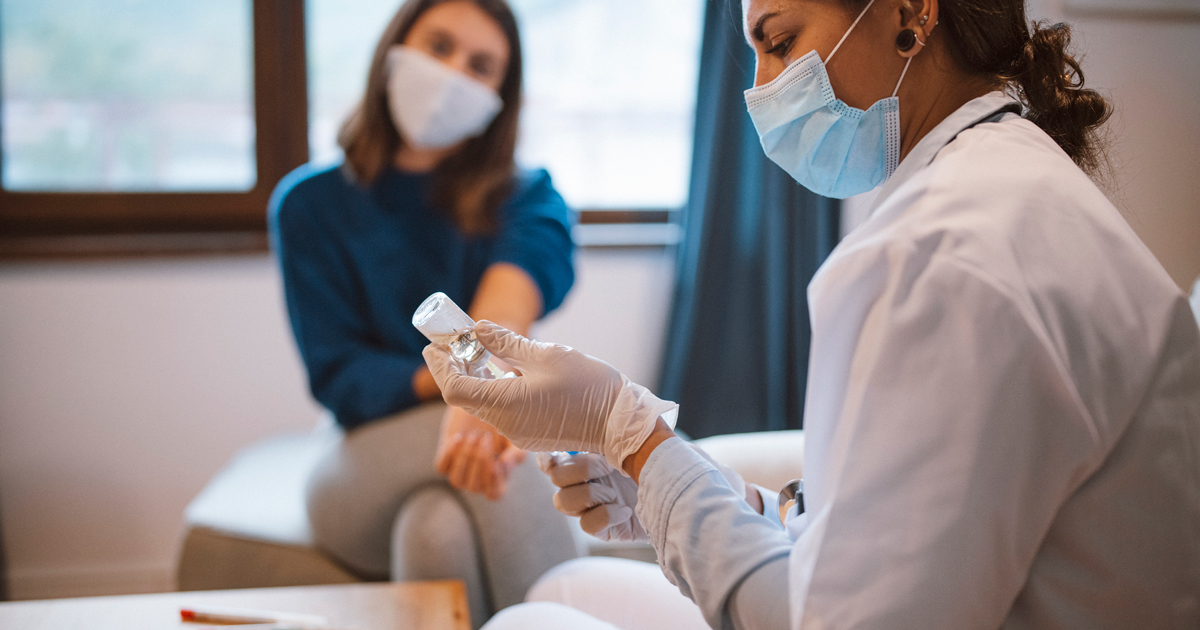 picture of a patient waiting for her COVID-19 vaccine