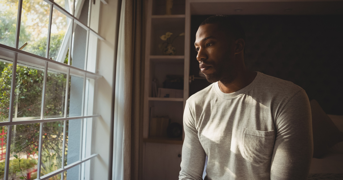 Young man looking out the window