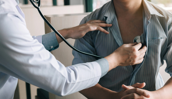 picture of a doctor listening to a patient's heart