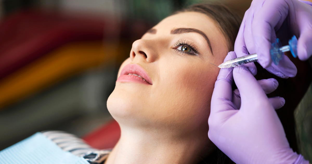 Woman receiving cheek filler