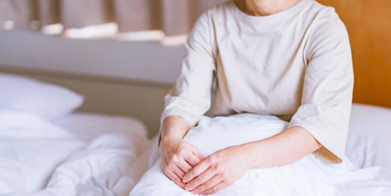 picture of a woman sitting in bed