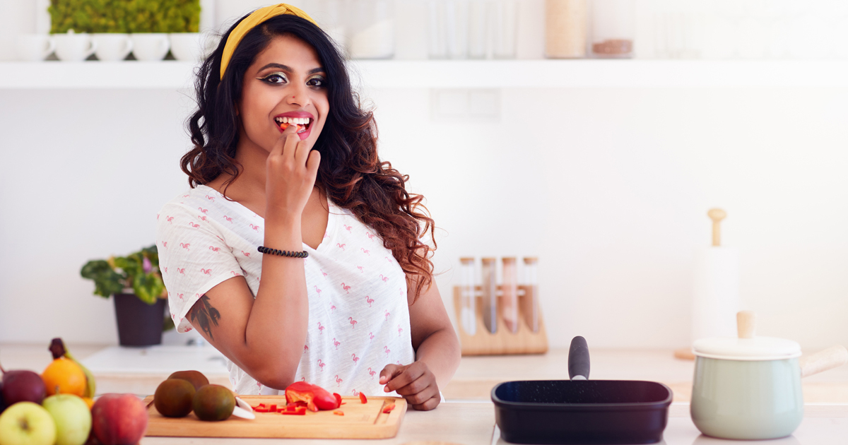 Woman cutting fruits and vegetables