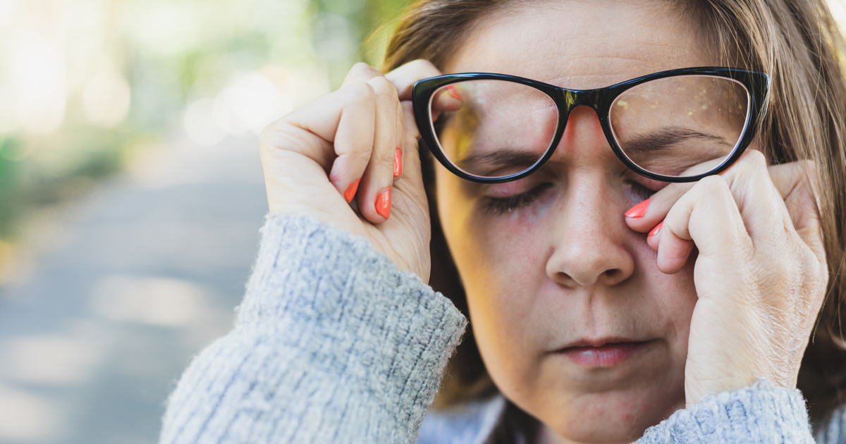 Woman wiping eyes