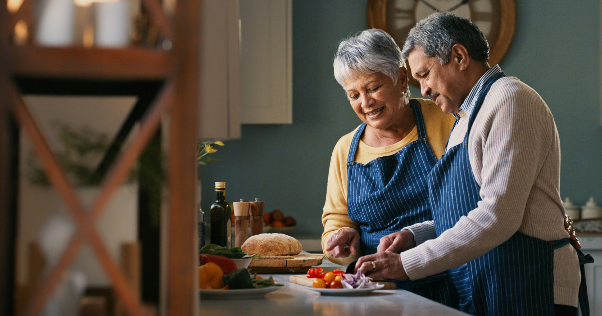 Husband and wife cooking in the kitchen