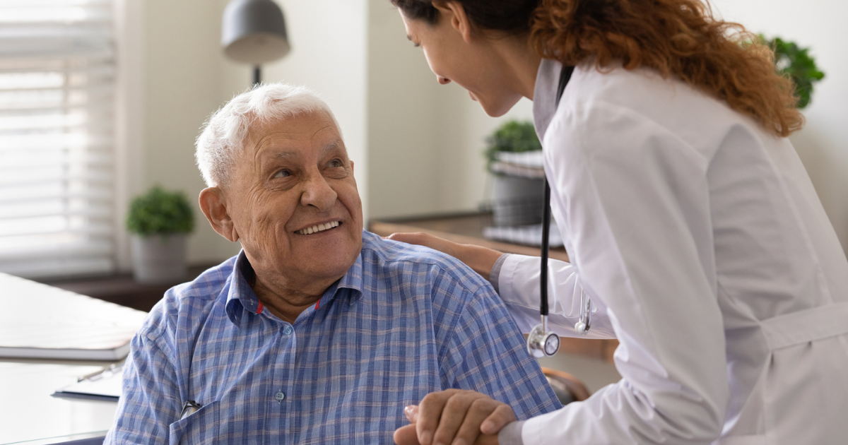 Older man talking to his doctor