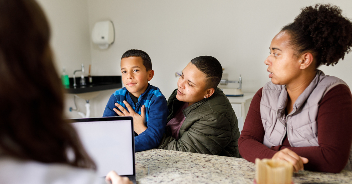 Mother, father, and young son in a doctor's office