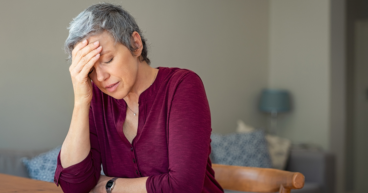 picture of a woman struggling with a headache