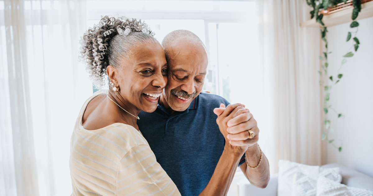 Older woman dancing with an older man