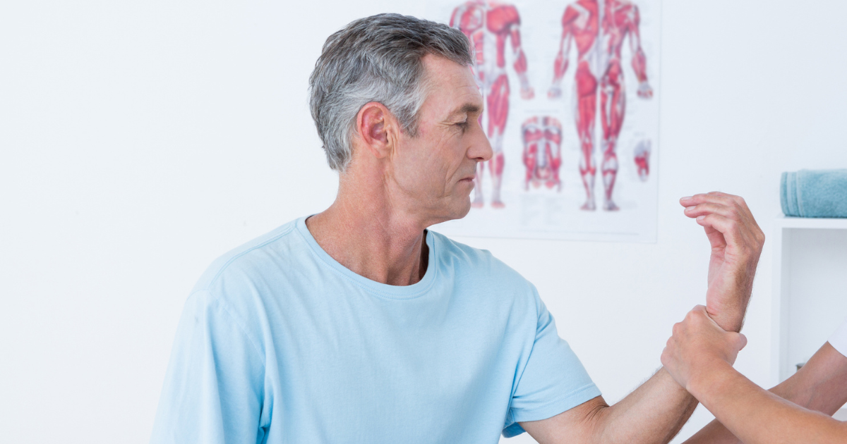 Man getting his hand examined