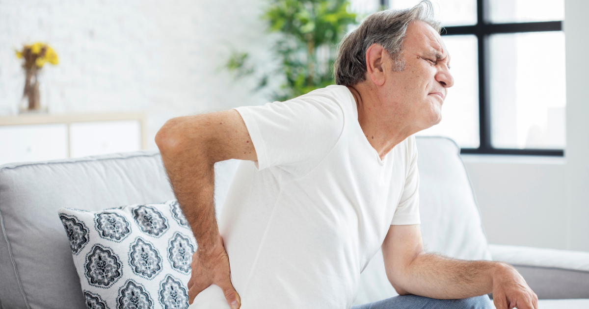 Man holding his back in pain