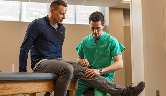 Kray Zeller, patient (left) with Matthew Tao, MD, orthopaedic surgeon