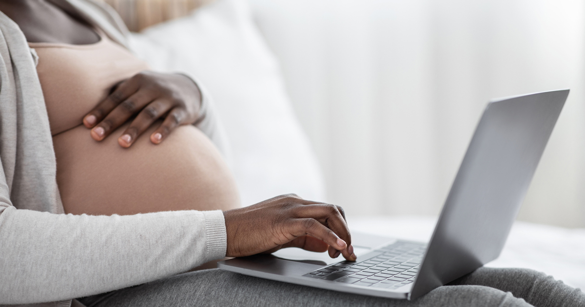 Pregnant woman on computer