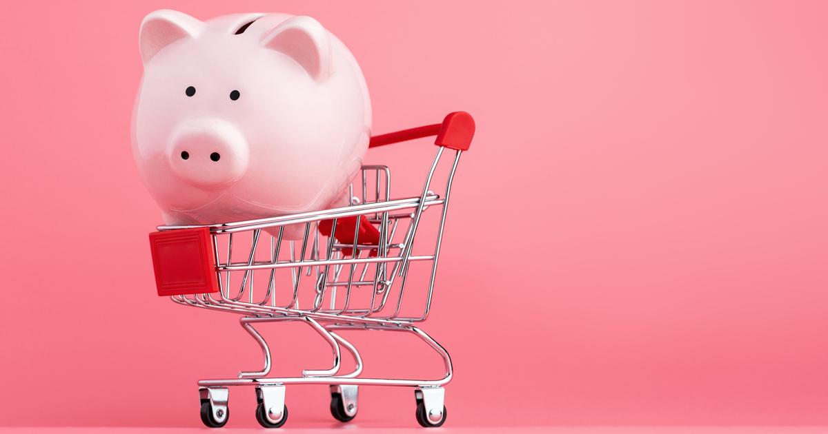 Piggy bank inside a grocery cart