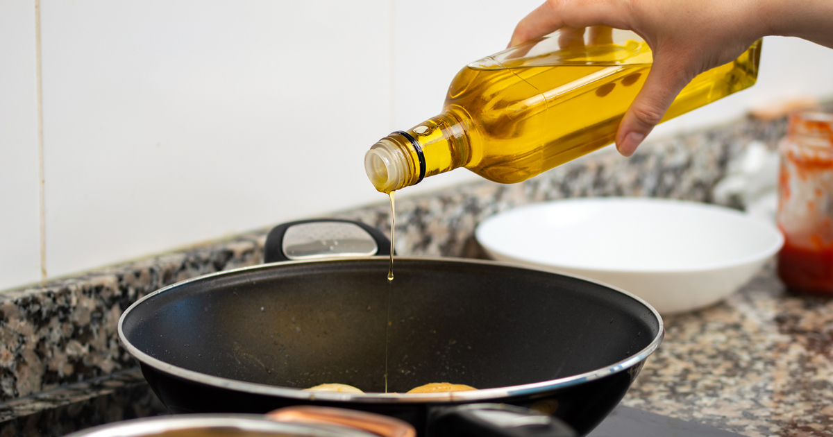 Pouring oil in a pan