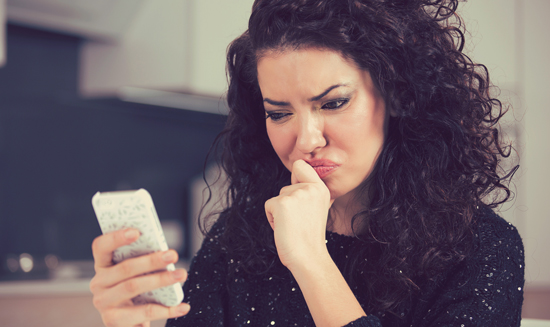 picture of a woman looking at her phone