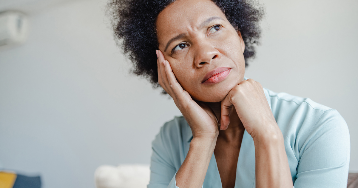 Woman looking up worried