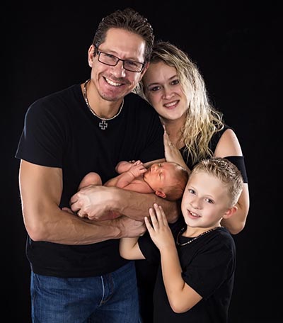 Rene, with wife, Jenny, and sons Eli and Evan (standing)