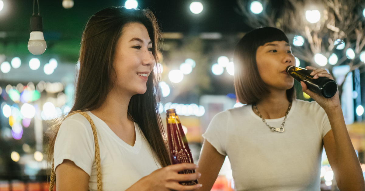 Two women drinking beer