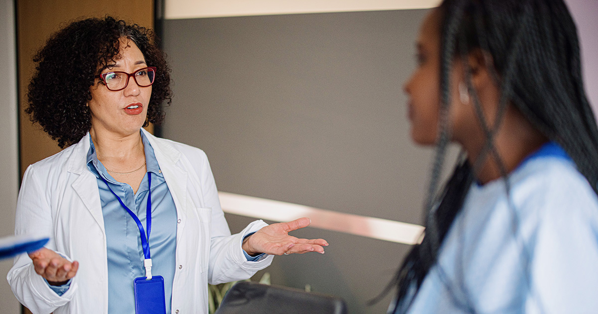 picture of a woman talking to her doctor