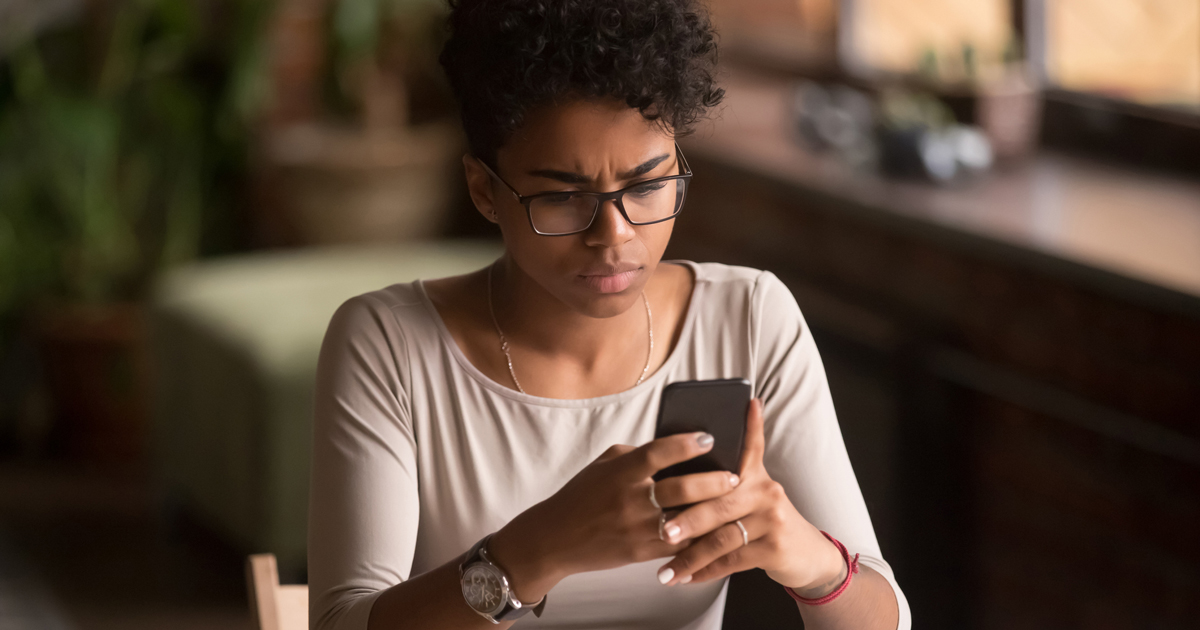 Young woman looking at her phone