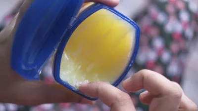 picture of a woman holding petroleum jelly