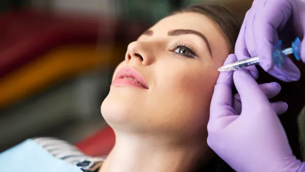 Woman receiving cheek filler