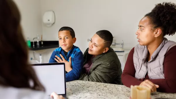 Mother, father, and young son in a doctor's office