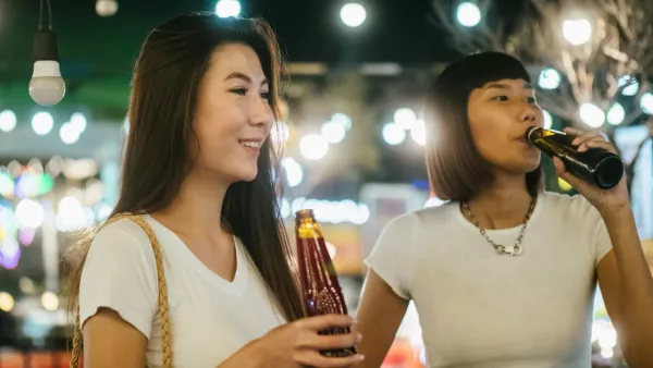 Two women drinking beer