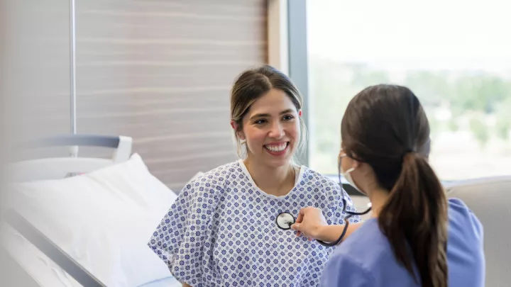 Woman at the doctor's office getting her heart checked