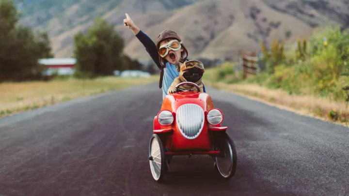 picture of a kid in a toy car