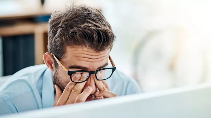 Man rubbing his eyes
