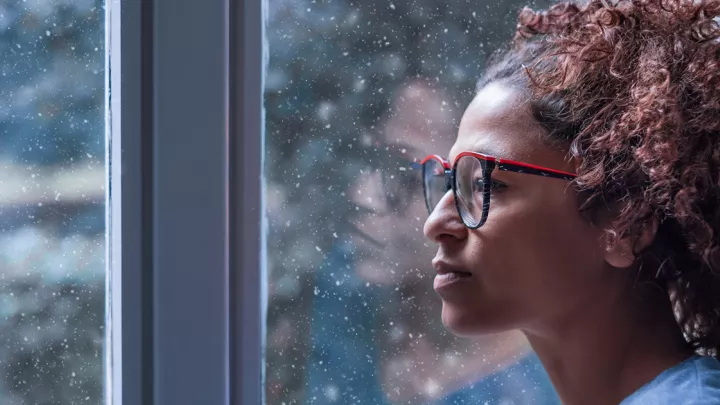 Woman staring out a window