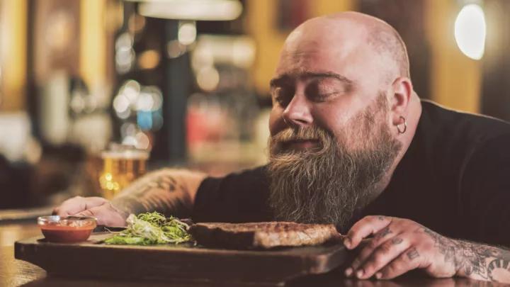 Man smelling a steak